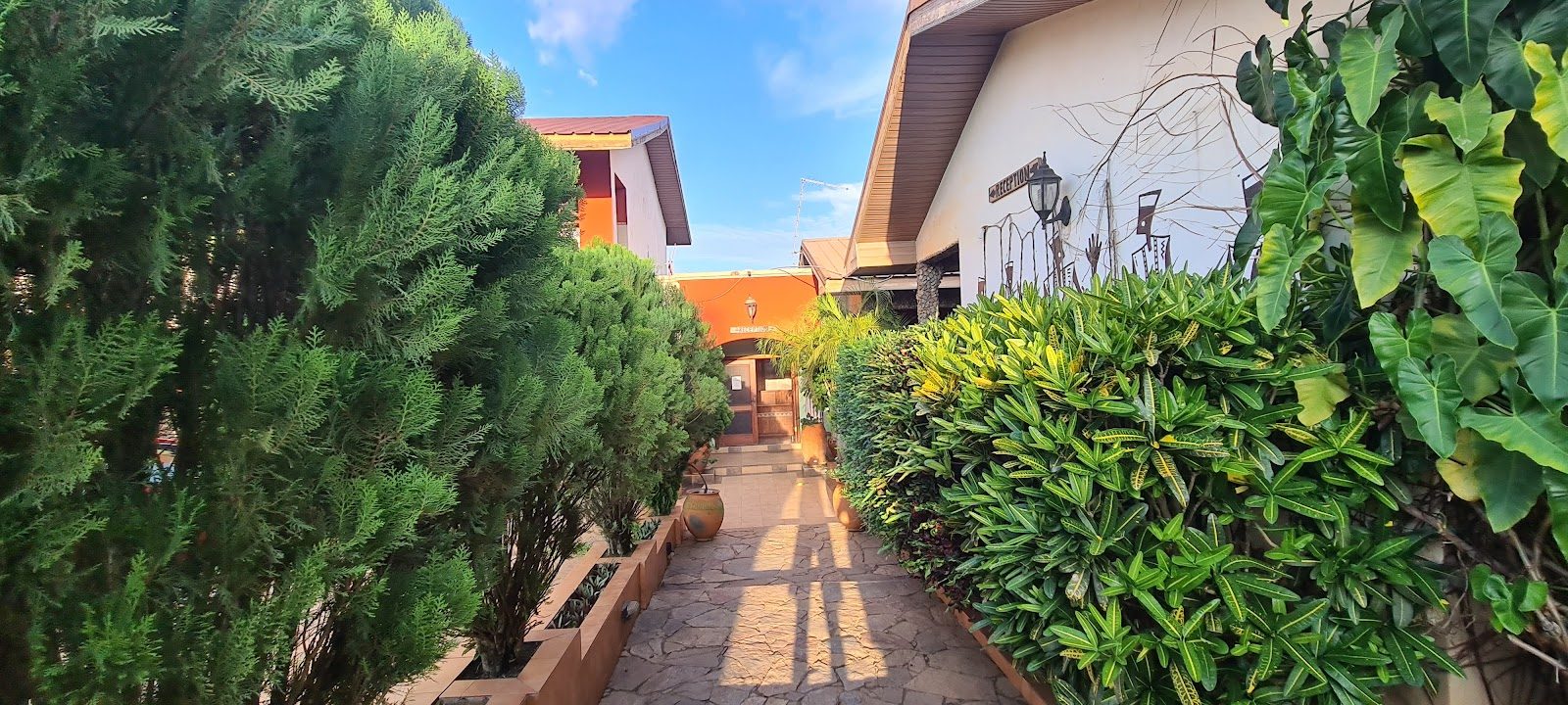 The garden-lined approach to Kyerewaa Hotel reception